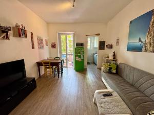 a living room with a couch and a table at Dora Flow in Banchette