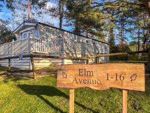 a sign in front of a tiny house at 5 Pine Rise in Poole