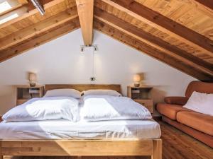 a bedroom with two beds in a attic at Holiday Home Leonardo by Interhome in Sorico