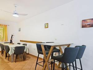 a dining room with a table and chairs at Holiday Home Gorana by Interhome in Mirce