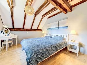 a bedroom with a bed and a table and a desk at Holiday Home Ferienpark Vorauf-4 by Interhome in Molberting