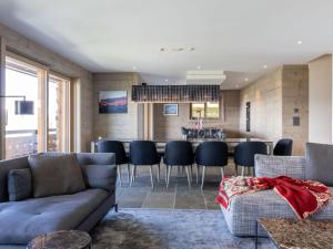 a living room with a couch and a table at Apartment Le Refuge 1 by Interhome in Nendaz +39 photos