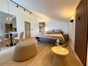 a bedroom with a bed and a chair and a table at Villa Tina Luxury Suite Newly Renovated 2026 in Novigrad Istria +152 photos