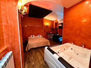 a room with a bath tub and a bed at Suites Moya 1 - SPA in Camera in Rome +26 photos