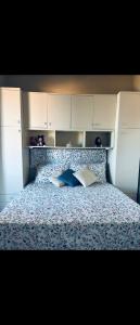 a bedroom with a bed with two pillows on it at Bungalow sul mare in Costa Rei