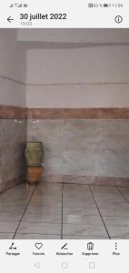 a picture of a room with a vase on a wall at Luxury in El Haouaria +2 photos