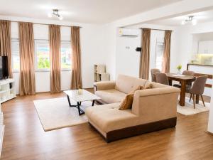 a living room with a couch and a table at Vila Elena in Gevgelija
