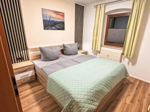 a bedroom with a bed and a window at Apartment Apartment Wuff by Interhome in Altendorf