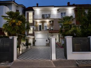 a house with a gate in front of it at Vila Elena in Gevgelija