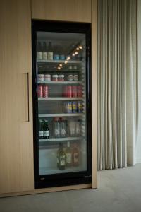 a refrigerator filled with lots of food and drinks at B&B Abdeshof in Middelkerke