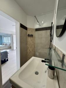 a bathroom with a sink and a mirror at Villa Schober Baška in Baška +100 photos