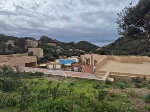a view of a house with a swimming pool at Casa di Luga in Costa Paradiso