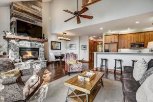 a living room with a couch and a fireplace at Arrowhead Village, A Vail Resorts Property in Edwards