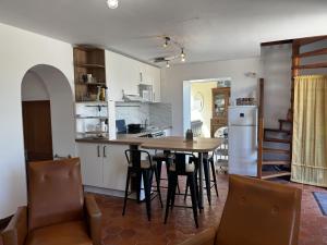 a kitchen and dining room with a table and chairs at Holiday Home La houle by Interhome in Cancale