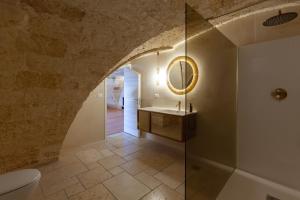 a bathroom with a sink and a glass shower at Monteforte Suite & Spa in Ugento +93 photos