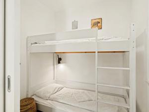 a room with two bunk beds in it at Apartment Seewind by Interhome in Lembruch