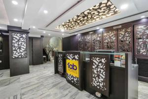 a lobby of a hotel with a lobby at FabHotel Backstreet, Bhopal Railway Station in Bhopal