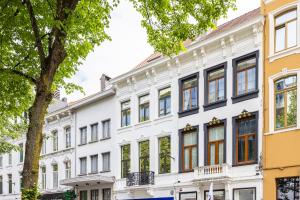 a large white building with many windows at GemStay Antwerp in Antwerp