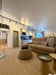 a living room with a couch and a table at Villa Tina Luxury Suite Newly Renovated 2026 in Novigrad Istria