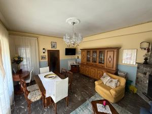 a living room with a couch and a table at Casa Della Nonna in Radicofani