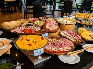 a buffet of different types of food on a table at Wyndham Bogota in Bogotá