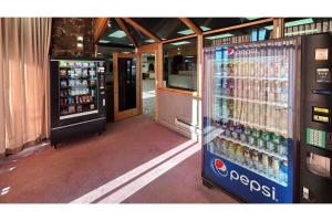 a soda machine in front of a store at Studio 6 Pocatello, ID in Pocatello
