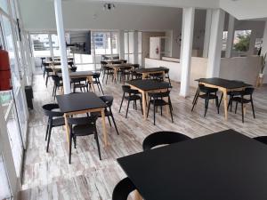 a room with tables and chairs in a restaurant at CRISTAL BuenaVista in Villa Carlos Paz