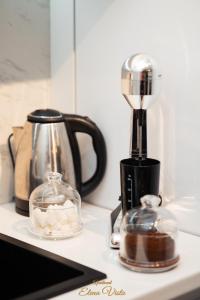 a kitchen counter with a blender and a tea kettle at Elena Vista Apartments in Štip