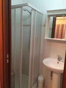 a bathroom with a shower and a sink at affittacamere casaGiarelli&Battistini in Monti di Licciana Nardi