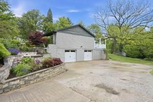 a house with a driveway and a garage at Mason Ranch - Game Room in Mason