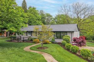 a house with a garden in front of it at Mason Ranch - Game Room in Mason