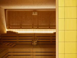 an empty sauna with a bucket in the middle at Mama Shelter Roma in Rome