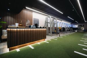 an office with a reception desk and green carpet at St Elisabeth Hotel & Spa in Tromsø +52 photos