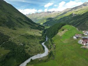 an aerial view of a river in a valley at The Moss - Your unique hideaway in Obergurgl