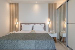 a bedroom with a large bed and two night stands at Aqua Blue Villa in Amoopi +42 photos