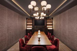 a conference room with a long table and chairs at White Elephant Aspen in Aspen