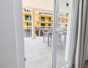 a view of a balcony with a table and chairs at Hostal Sol de Mallorca in El Arenal