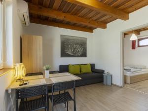 a living room with a couch and a table at Apartment Lena 2 by Interhome in Balatonberény