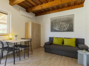 a living room with a couch and a table at Apartment Lena 2 by Interhome in Balatonberény +18 photos