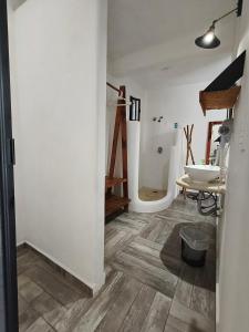 a bathroom with a sink and a toilet in a room at teki-sha home&suites in Bacalar +36 photos