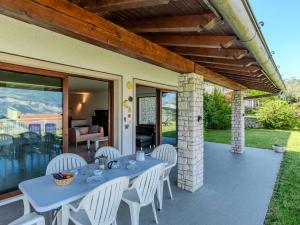 a table and chairs on the patio of a house at Villa Manuela by Interhome in Brenzone sul Garda