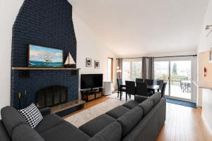 a living room with a couch and a fireplace at 58 River Rd. East in Wasaga Beach