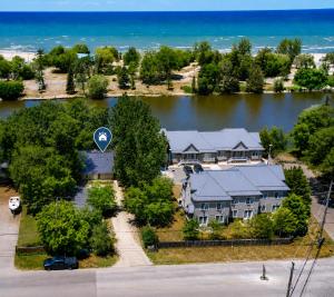 an aerial view of a house with a street sign at 58 River Rd. East in Wasaga Beach