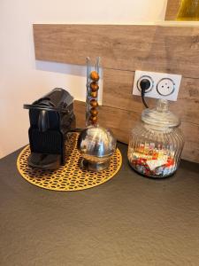 a counter top with a toaster and a tea kettle at L apparte Sciez in Sciez
