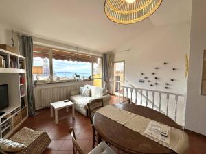 a living room with a table and a couch at La terrazza su Assisi in Assisi