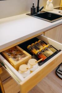 an open drawer in a kitchen with food at Monside Resort - AIR CABIN in Borzont +3 photos