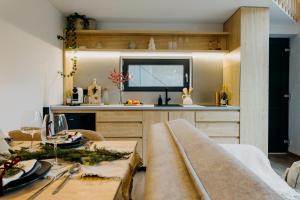 a living room with a table and a kitchen at Monside Resort - AIR CABIN in Borzont