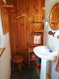 a bathroom with a white sink and a shower at Chata v lese pri rieke Bela in Pribylina +23 photos