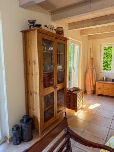 a wooden cabinet with glass doors in a room at Casa Kasia by HolAp SA in Contra +42 photos