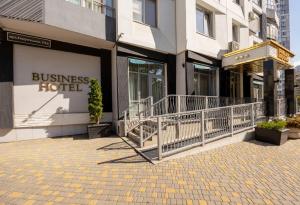 a building with a business hotel sign on it at Ribas Rooms Odesa in Odesa